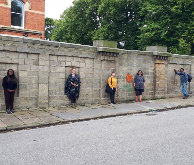 Artists in front of the boundary wall